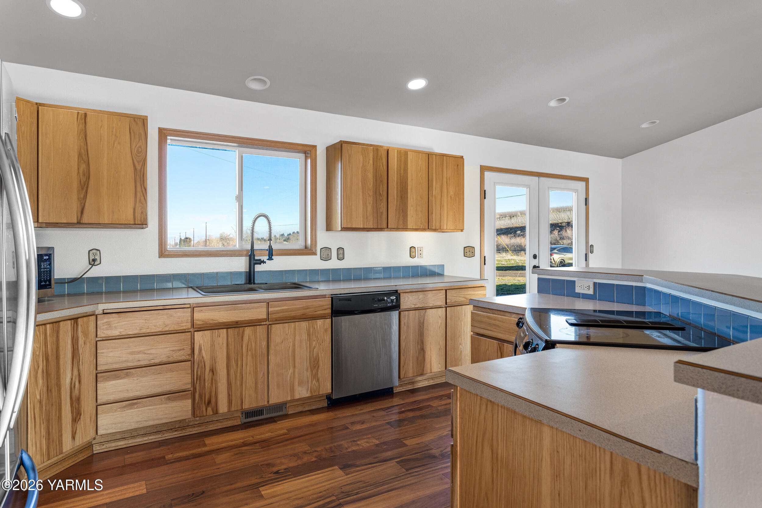 14929 Cottonwood Canyon Road Yakima, WA 98908 - Photo 13 of 55 a kitchen with a sink stove and cabinets