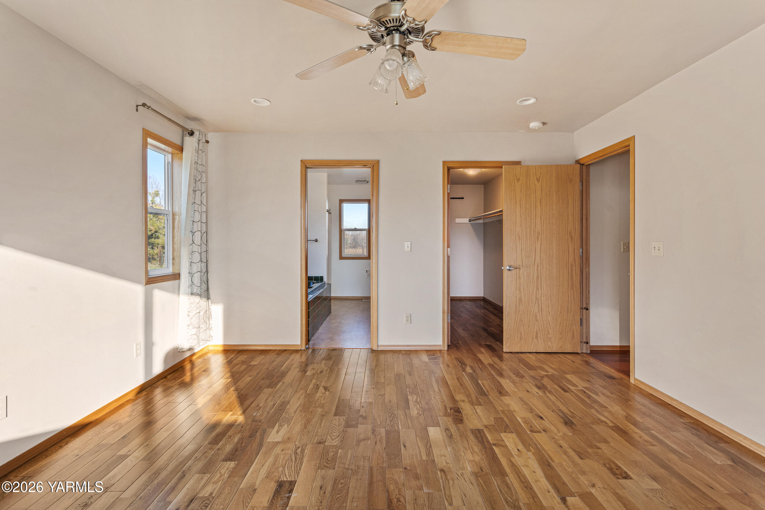 14929 Cottonwood Canyon Road Yakima, WA 98908 - Photo 22 of 55 a view of empty room with wooden floor and fan