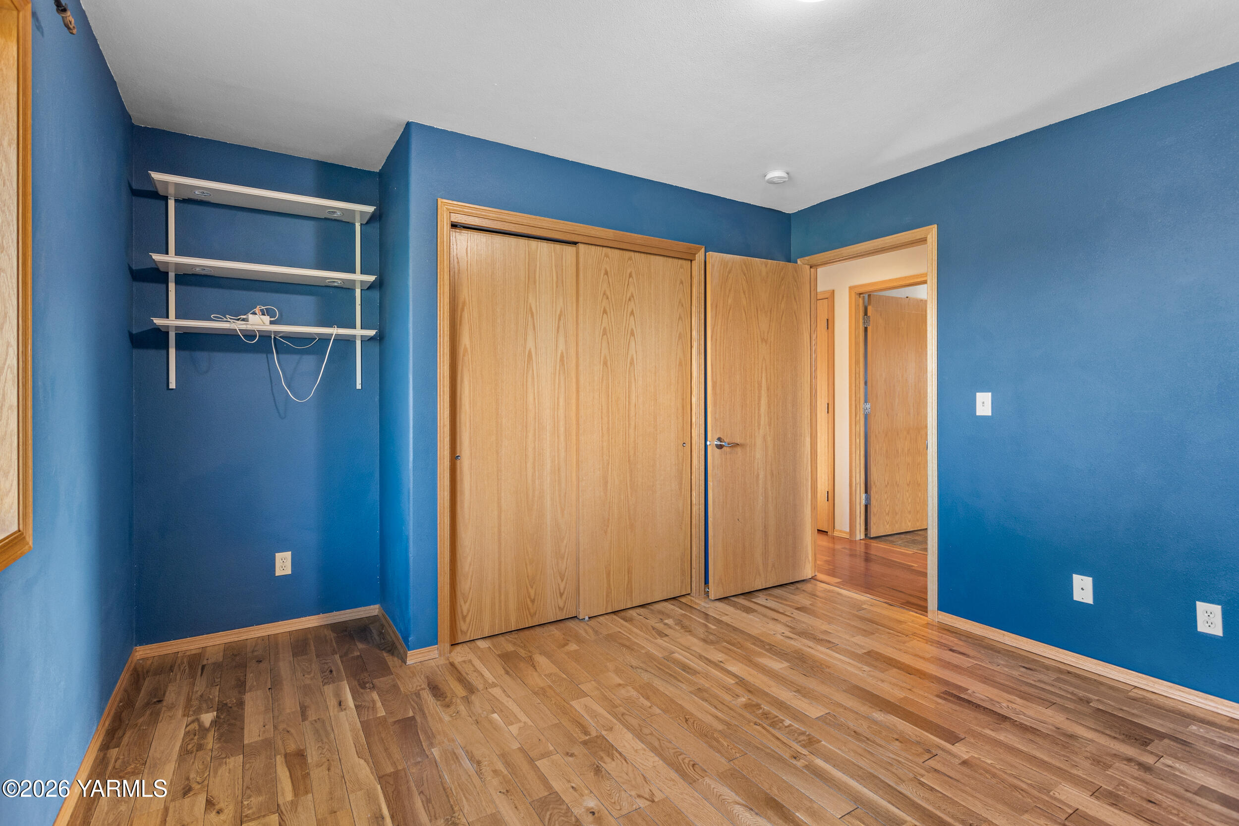 14929 Cottonwood Canyon Road Yakima, WA 98908 - Photo 28 of 55 a view of an empty room with wooden floor and a window