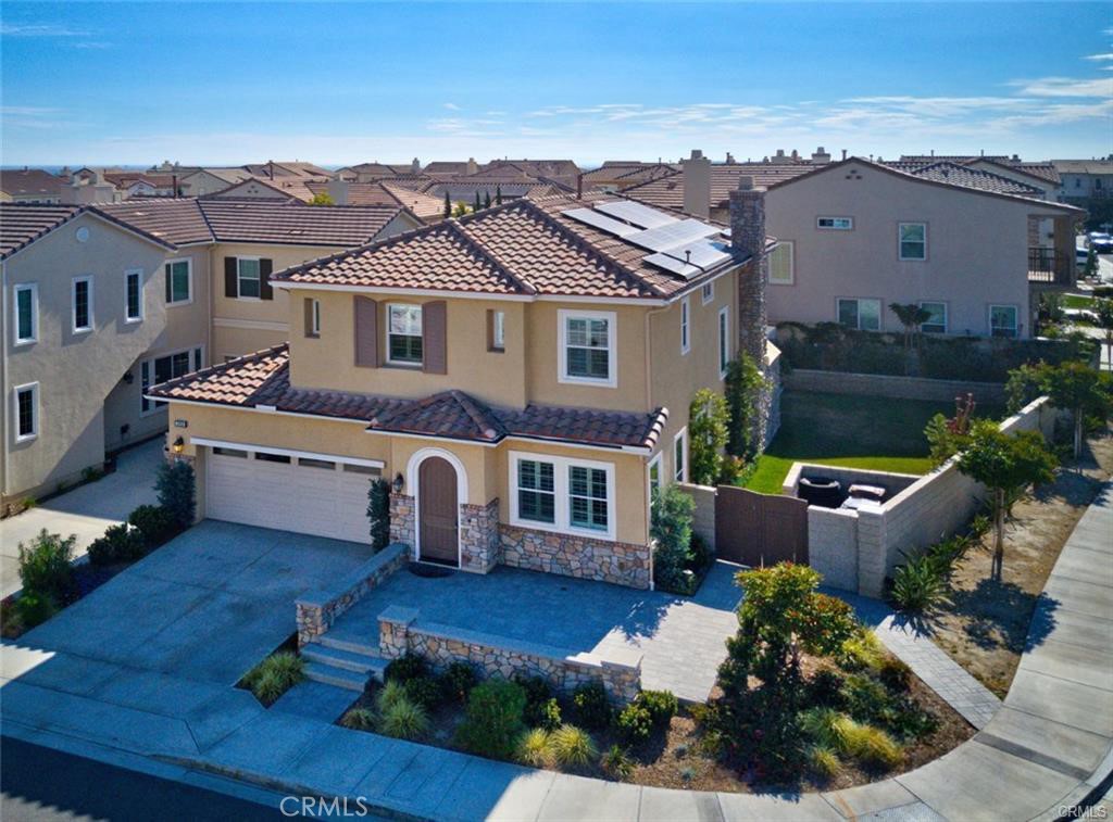3929 Somerset Road Yorba Linda, CA 92886 - Photo 2 of 5 a front view of a house with a garden and plants