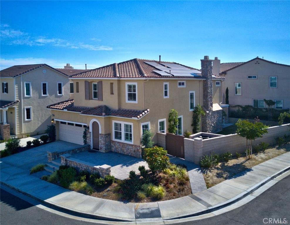 3929 Somerset Road Yorba Linda, CA 92886 - Photo 4 of 5 a front view of a house with a yard and potted plants