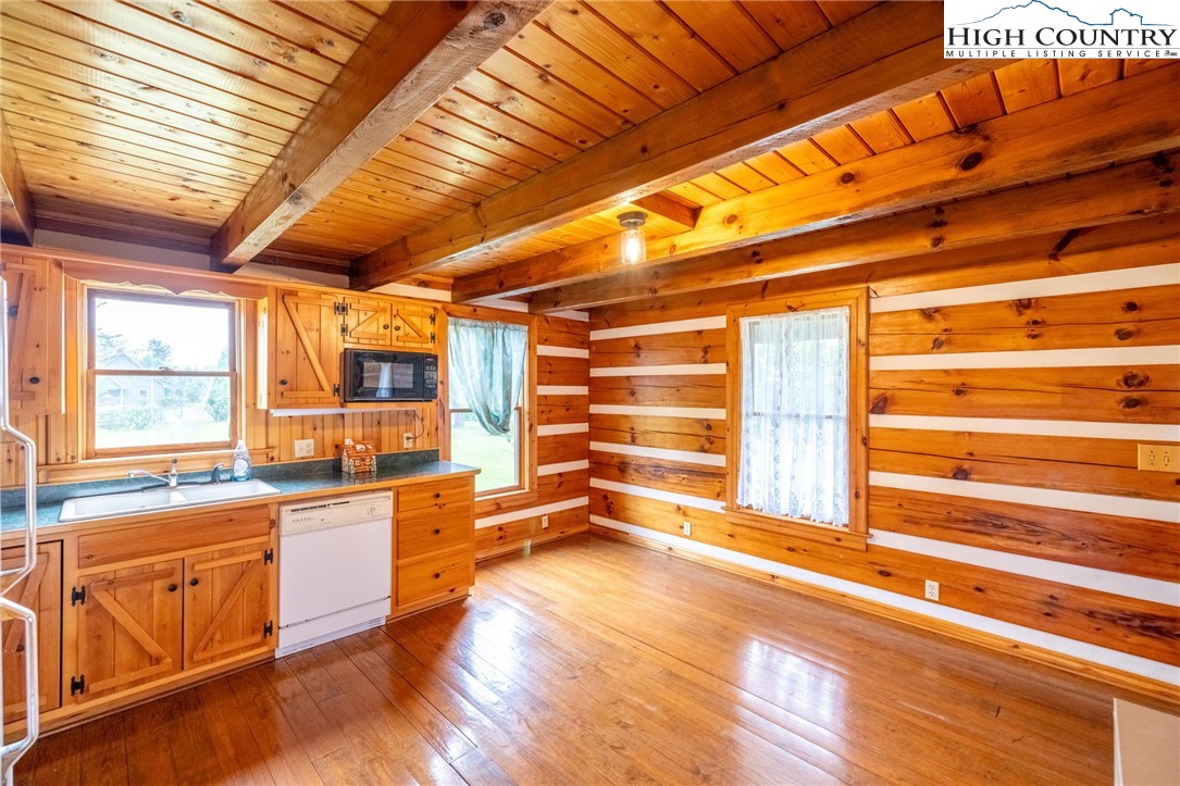 45 Bailey Road Ennice, NC 28623 - Photo 18 of 48 a kitchen with granite countertop a sink and a cabinets
