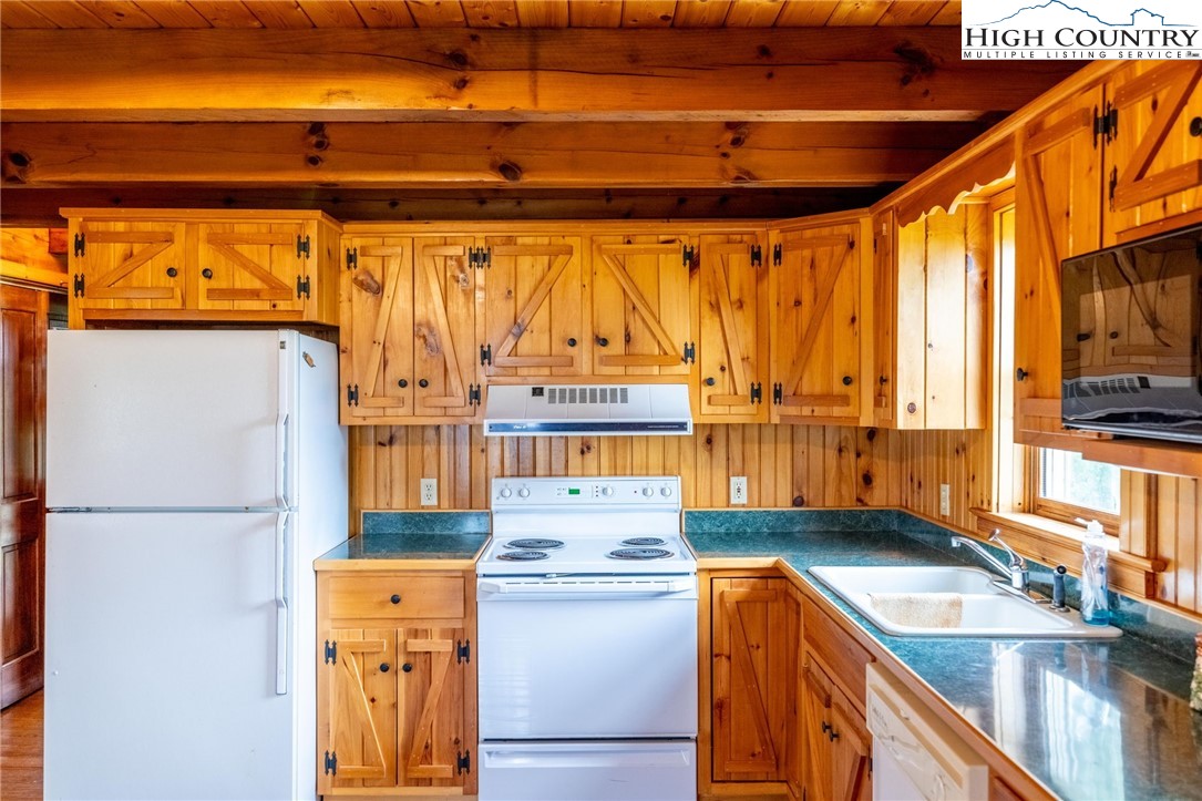 45 Bailey Road Ennice, NC 28623 - Photo 19 of 48 a kitchen with a sink stove and refrigerator