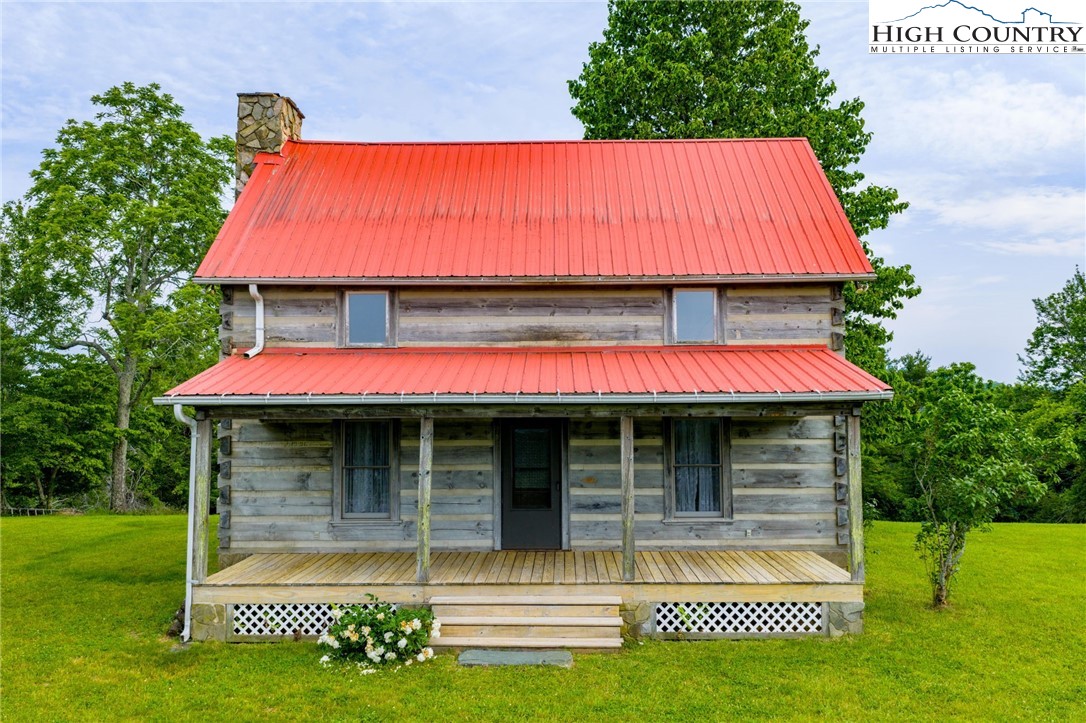 45 Bailey Road Ennice, NC 28623 - Photo 2 of 48 a view of a house with a yard porch and sitting area
