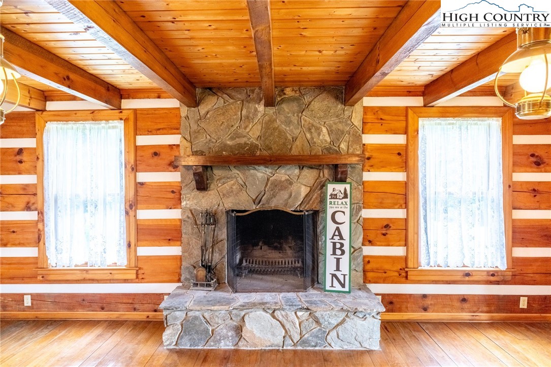 45 Bailey Road Ennice, NC 28623 - Photo 27 of 48 a living room with a fireplace and a table