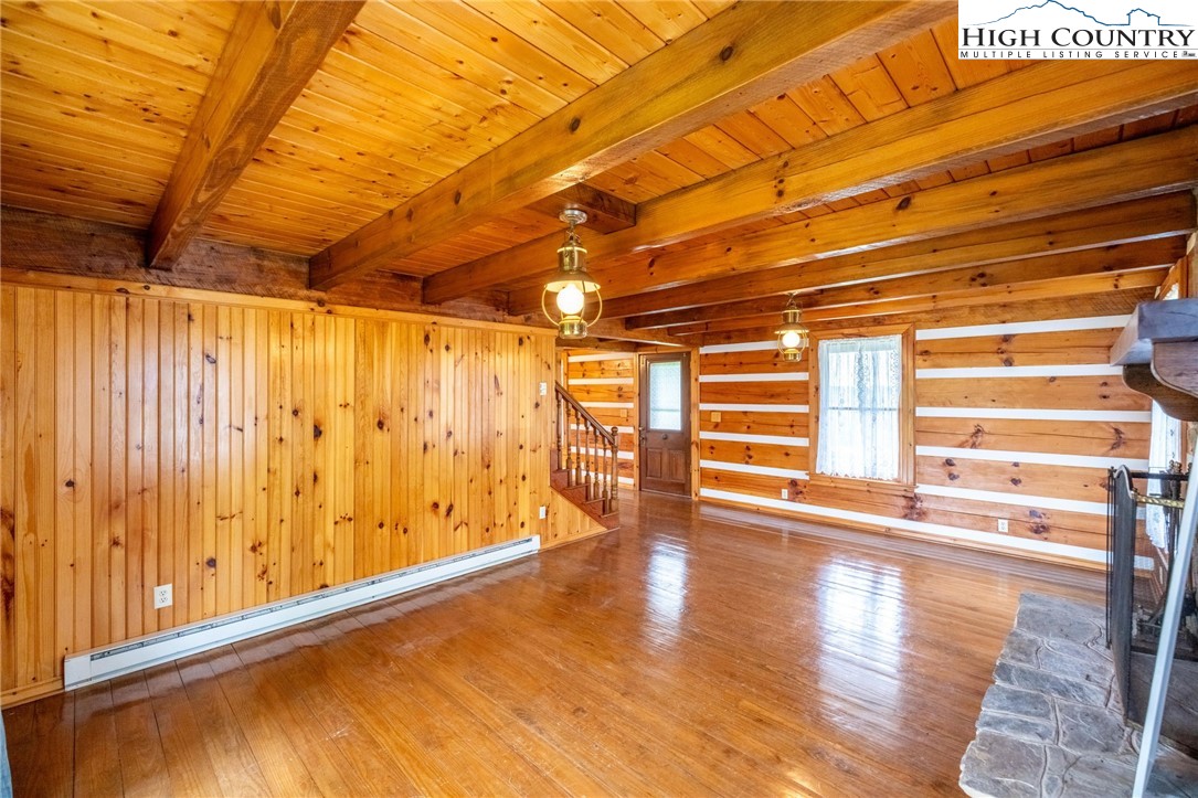 45 Bailey Road Ennice, NC 28623 - Photo 29 of 48 a view of empty room with wooden floor and windows