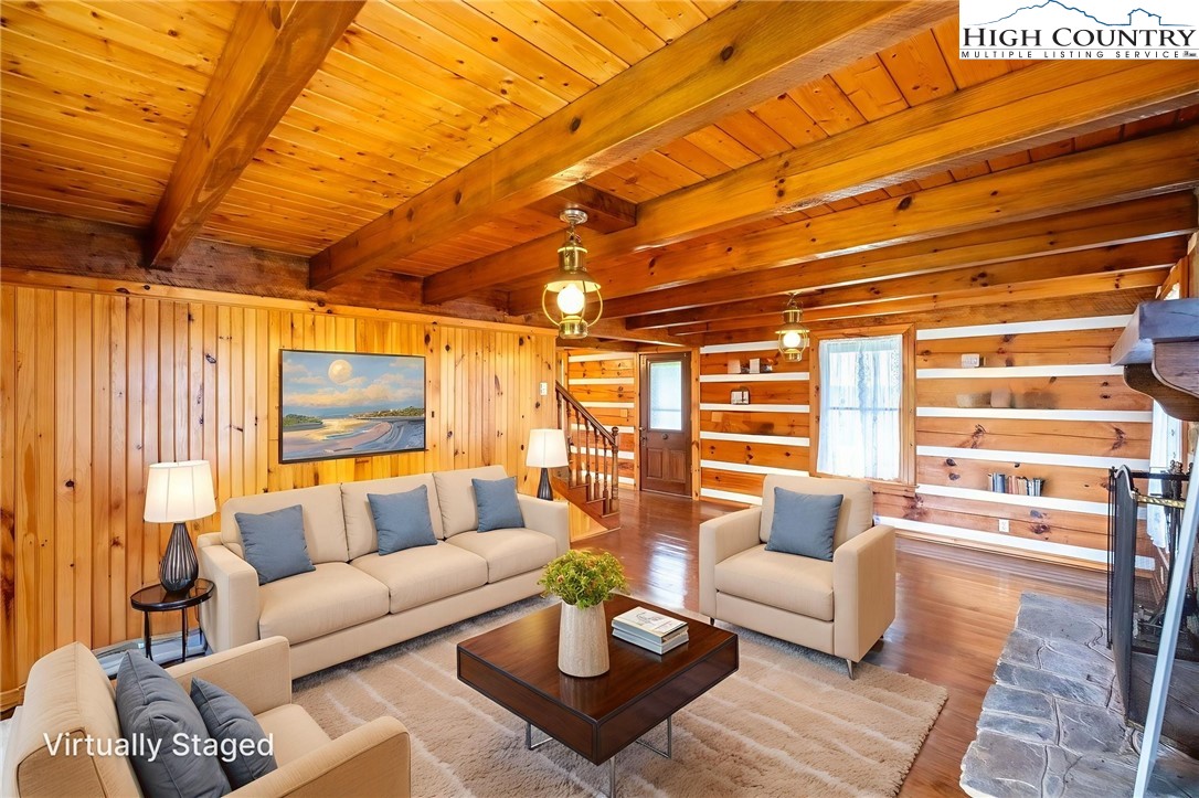 45 Bailey Road Ennice, NC 28623 - Photo 30 of 48 a living room with furniture and a large window