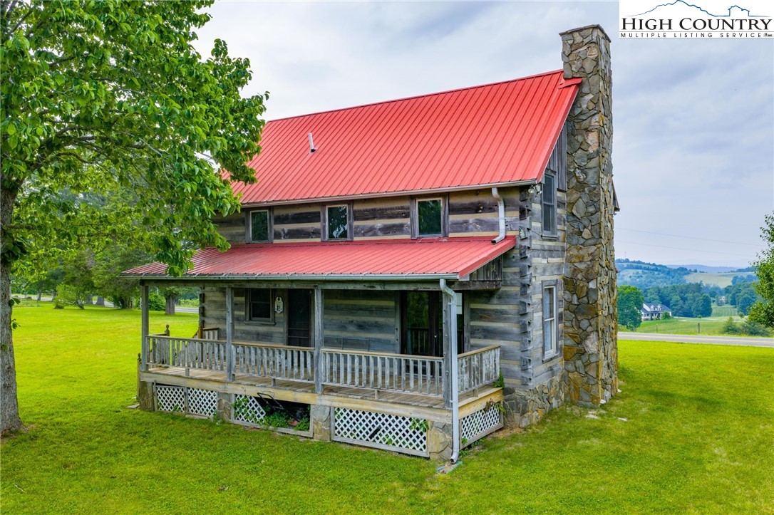 45 Bailey Road Ennice, NC 28623 - Photo 3 of 48 a view of a house with a yard