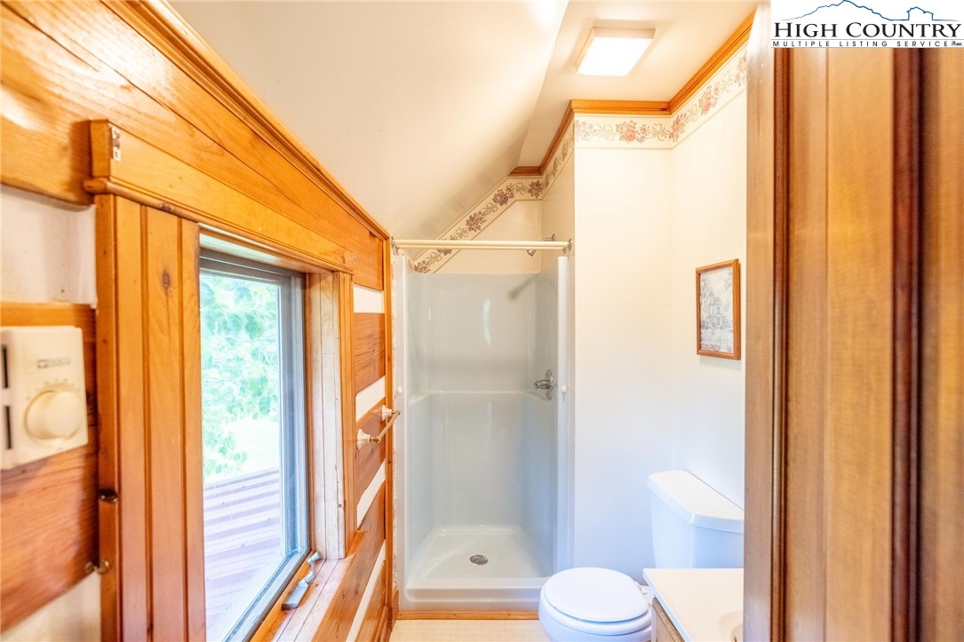 45 Bailey Road Ennice, NC 28623 - Photo 32 of 48 a bathroom with a shower and a toilet