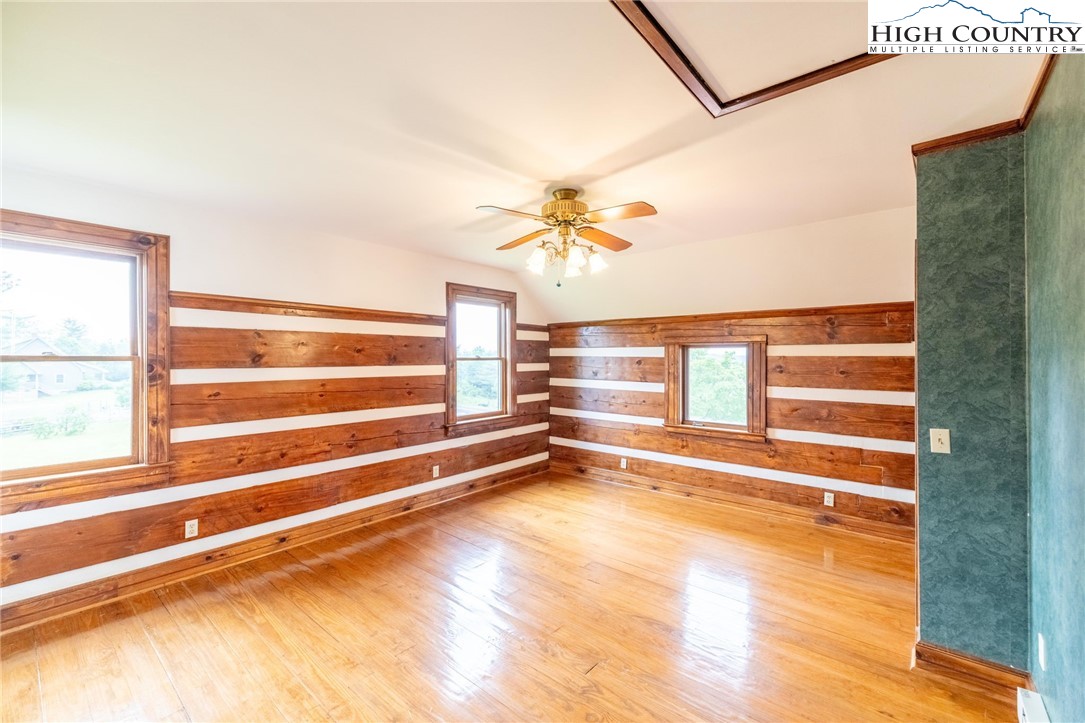 45 Bailey Road Ennice, NC 28623 - Photo 34 of 48 a view of an empty room with a window and wooden floor