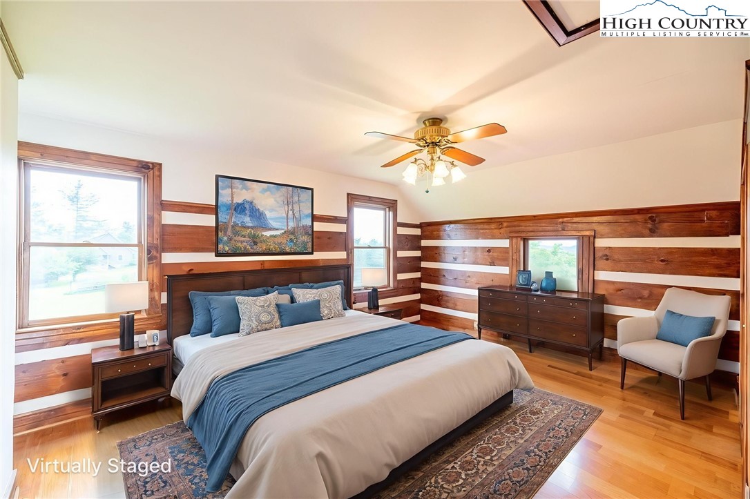 45 Bailey Road Ennice, NC 28623 - Photo 36 of 48 a bedroom with a bed a couch and a window with the outer view