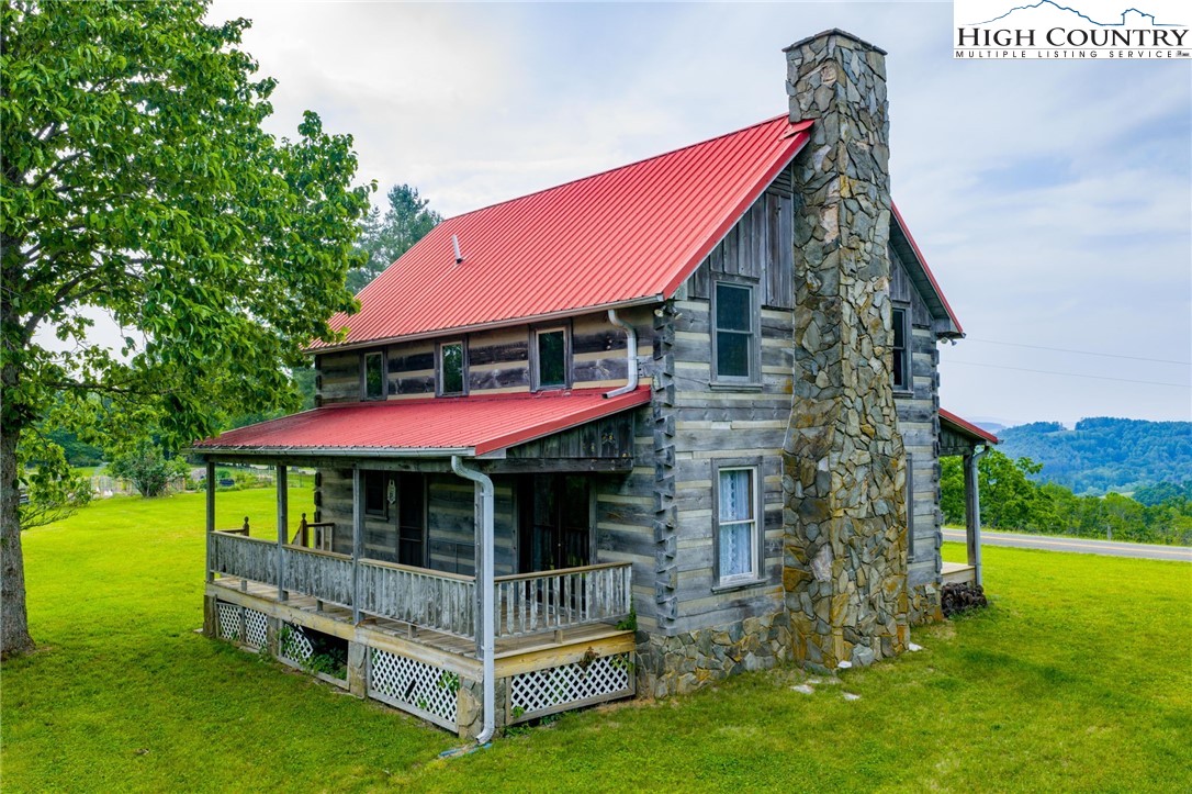 45 Bailey Road Ennice, NC 28623 - Photo 4 of 48 a view of a house with a yard