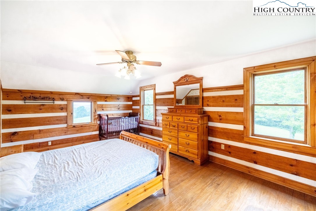 45 Bailey Road Ennice, NC 28623 - Photo 41 of 48 a bedroom with furniture and a large window