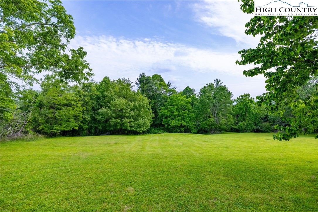 45 Bailey Road Ennice, NC 28623 - Photo 48 of 48 a view of a green field with clear sky