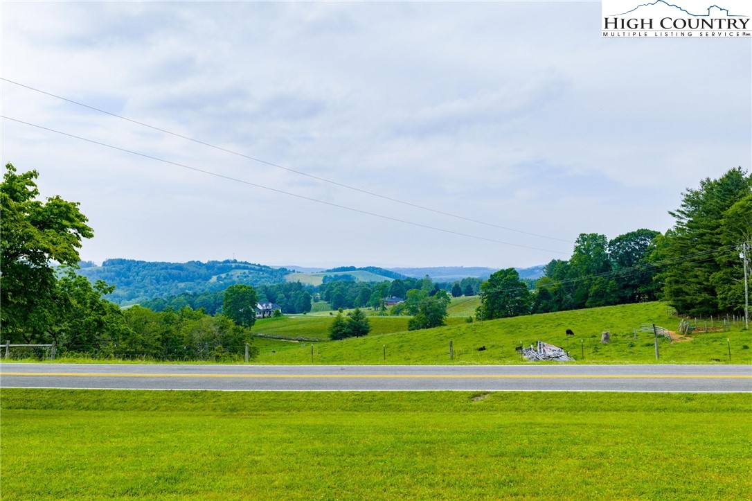45 Bailey Road Ennice, NC 28623 - Photo 5 of 48 a view of a green field with clear sky