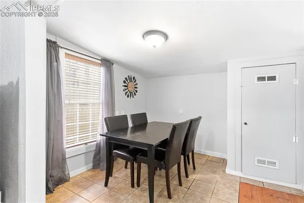 a view of a dining room with furniture