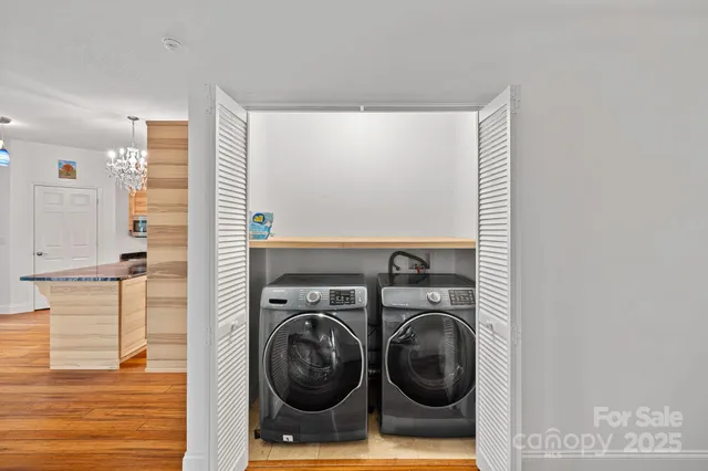 a view of a hallway with washer and dryer