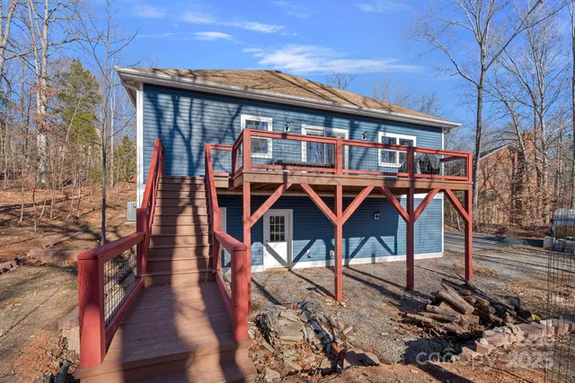 a front view of a house with wooden stairs