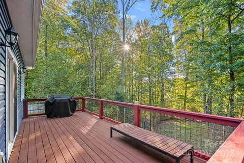 a view of balcony with furniture and wooden deck