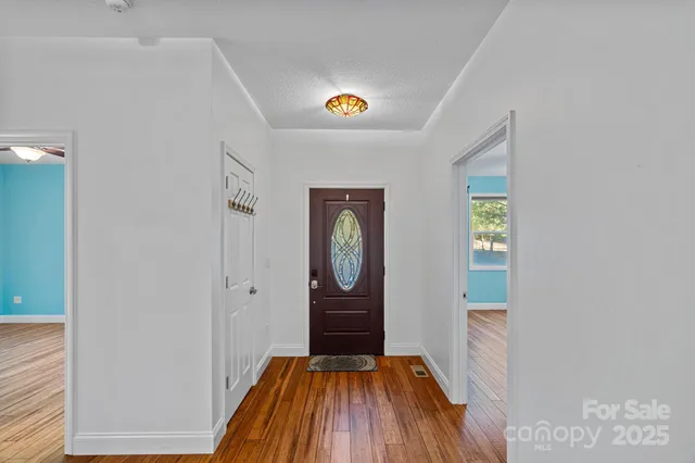 a view of a hallway view with wooden floor