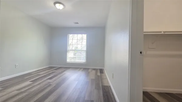 a view of a kitchen with a sink and a refrigerator
