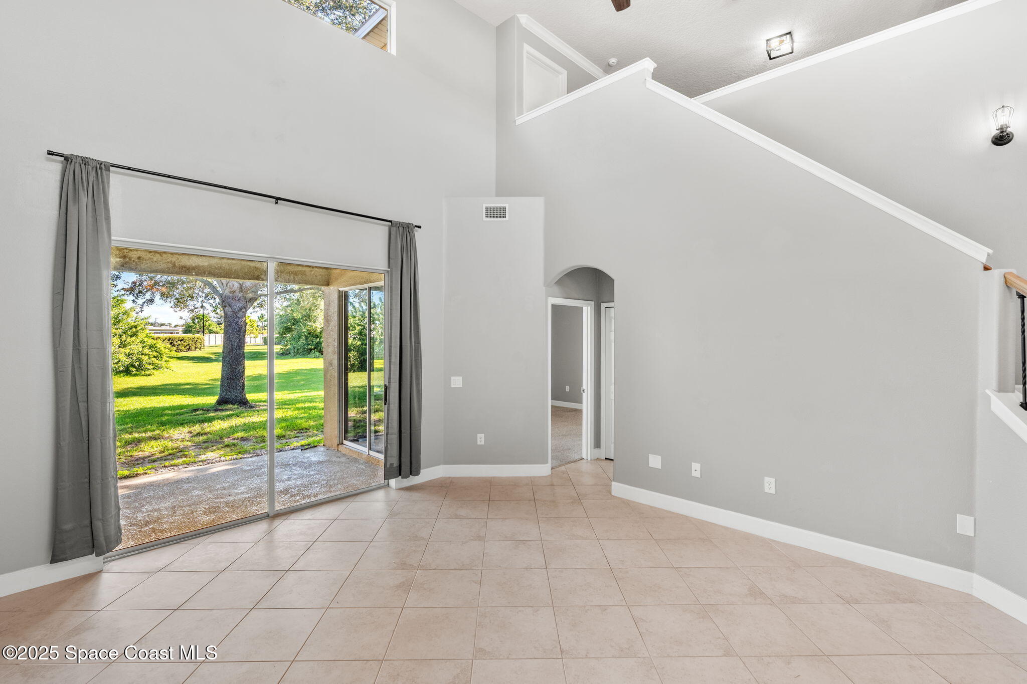 3126 Arden Circle Melbourne, FL 32934 - Photo 15 of 33 a view of an empty room with a window