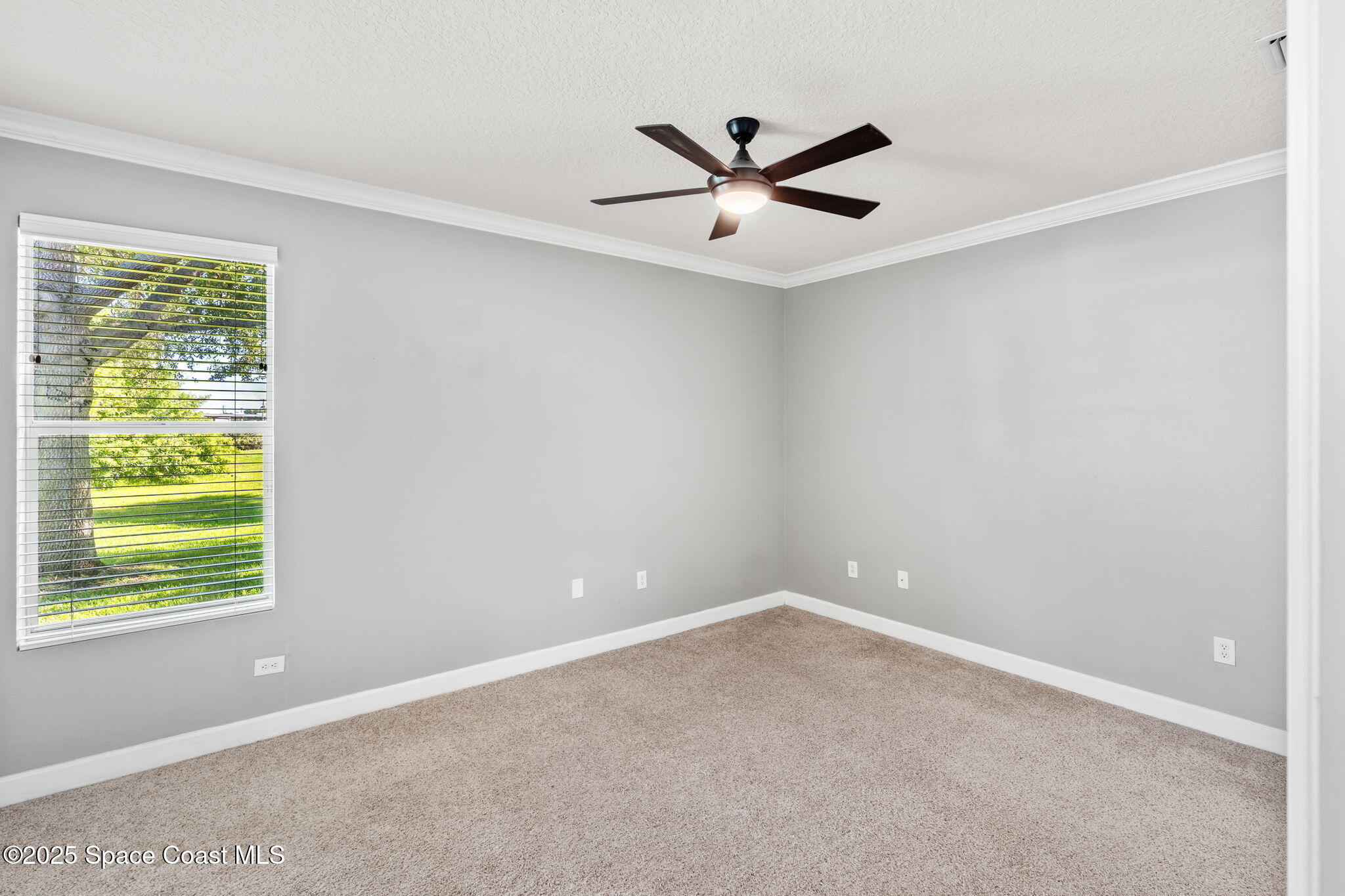 3126 Arden Circle Melbourne, FL 32934 - Photo 17 of 33 a view of a big room with windows