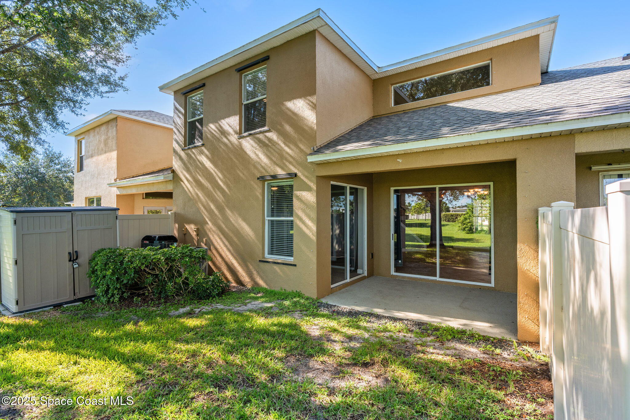 3126 Arden Circle Melbourne, FL 32934 - Photo 2 of 33 a front view of a house with garden