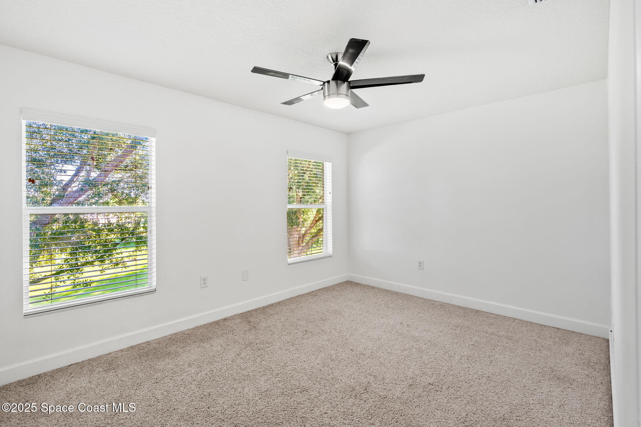 3126 Arden Circle Melbourne, FL 32934 - Photo 24 of 33 a view of an empty room with a window