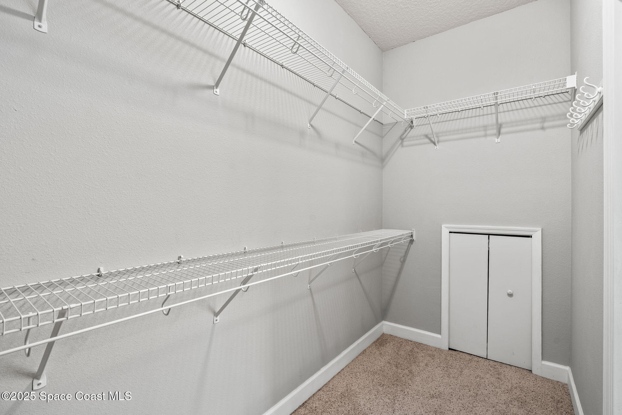 3126 Arden Circle Melbourne, FL 32934 - Photo 25 of 33 a view of a room with racks on the wall