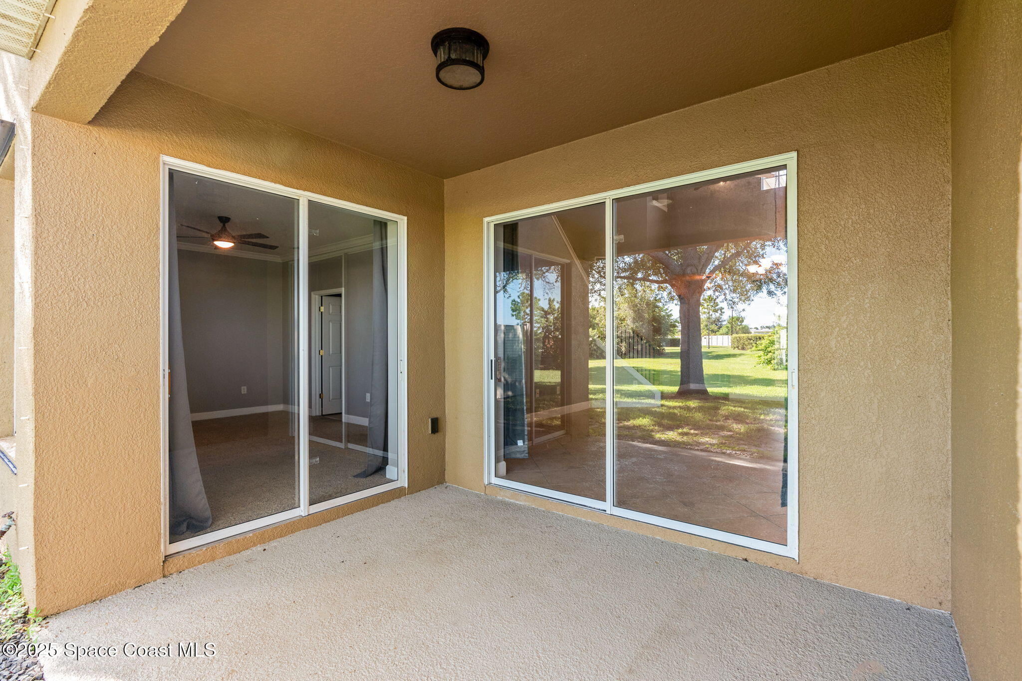 3126 Arden Circle Melbourne, FL 32934 - Photo 30 of 33 an empty room with sliding glass door and shower