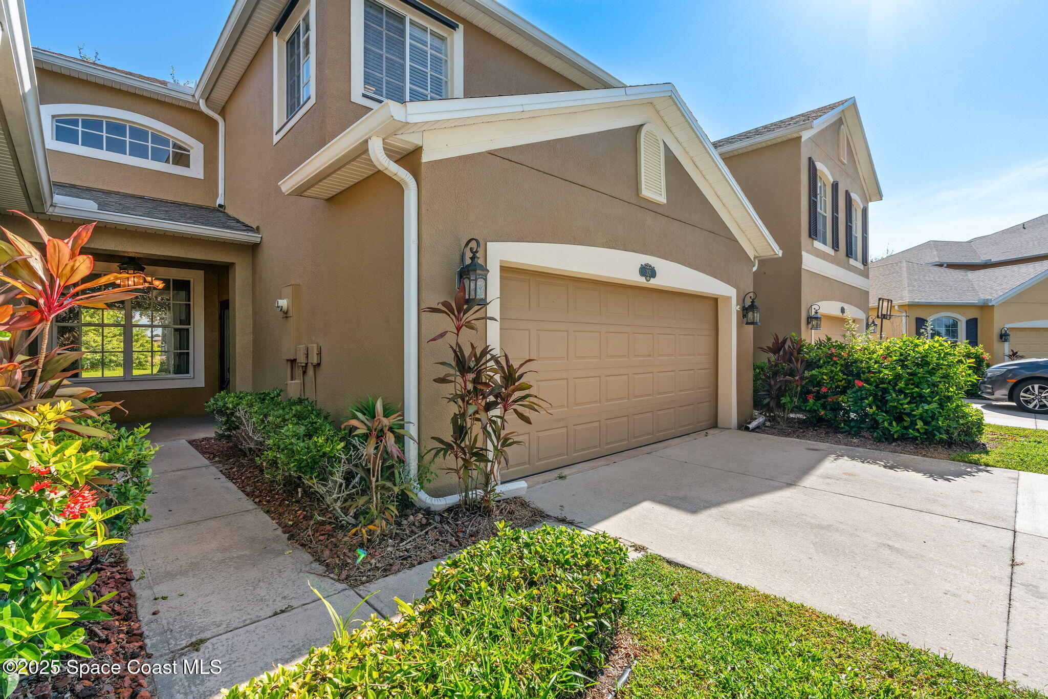 3126 Arden Circle Melbourne, FL 32934 - Photo 4 of 33 a front view of a house with garden