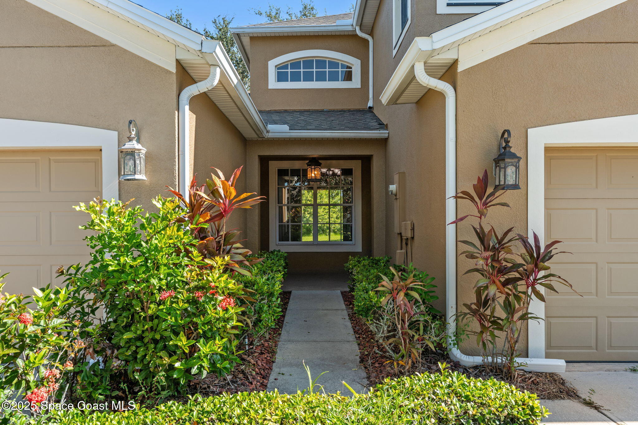 3126 Arden Circle Melbourne, FL 32934 - Photo 5 of 33 a view of a pathway with a flower garden
