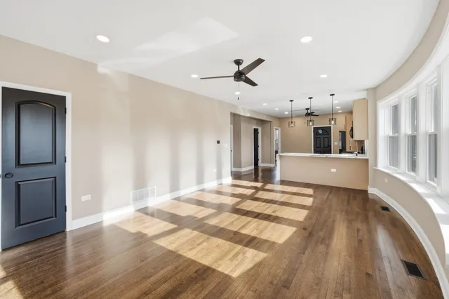 a large bedroom with a bed and a view of bathroom