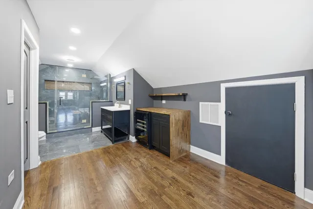 a view of a kitchen with furniture and a fireplace