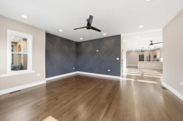 a view of a livingroom with wooden floor