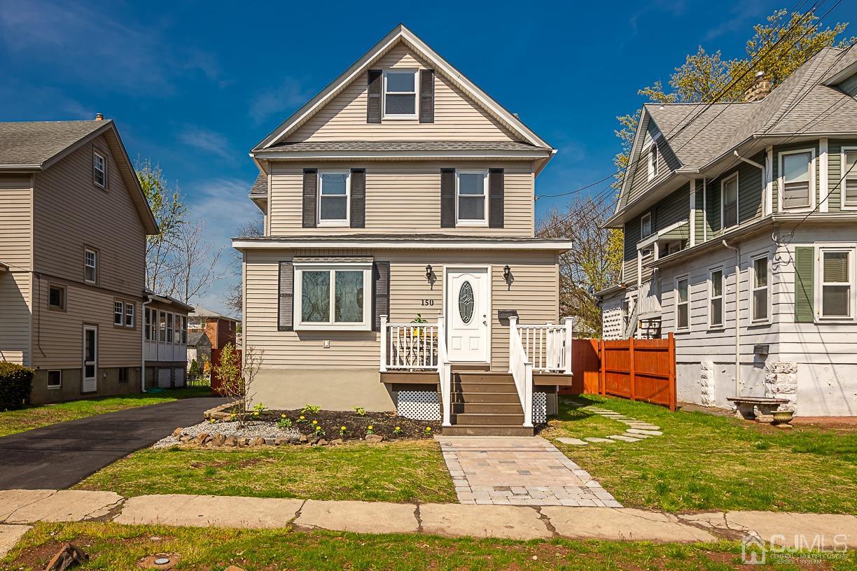 150 New Market Road Dunellen, NJ 08812 - Photo 1 of 22 a front view of a house with a yard