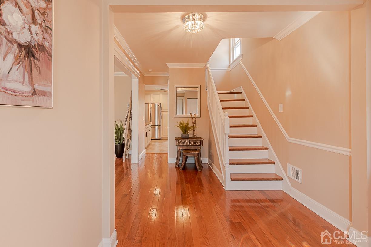 150 New Market Road Dunellen, NJ 08812 - Photo 2 of 22 a view of entryway and hall with wooden floor