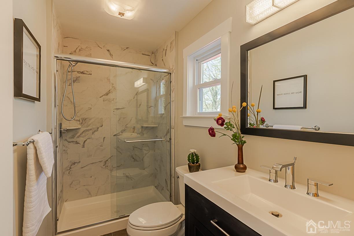 150 New Market Road Dunellen, NJ 08812 - Photo 11 of 22 a bathroom with a sink toilet and shower