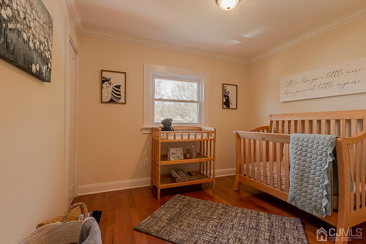 150 New Market Road Dunellen, NJ 08812 - Photo 13 of 22 a bedroom with furniture and a window