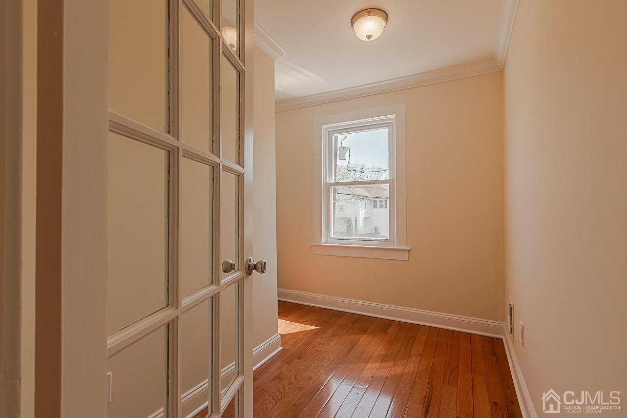150 New Market Road Dunellen, NJ 08812 - Photo 18 of 22 a view of an empty room with a window