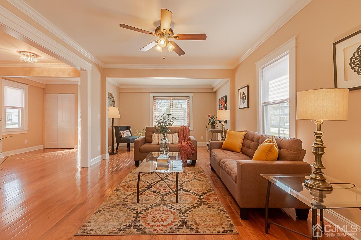 150 New Market Road Dunellen, NJ 08812 - Photo 5 of 22 a living room with furniture wooden floor and a large window