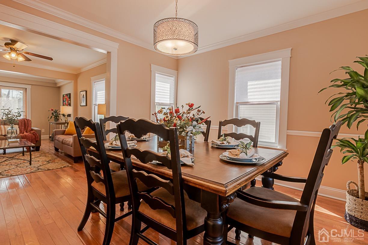 150 New Market Road Dunellen, NJ 08812 - Photo 7 of 22 a view of a dining room with furniture and wooden floor