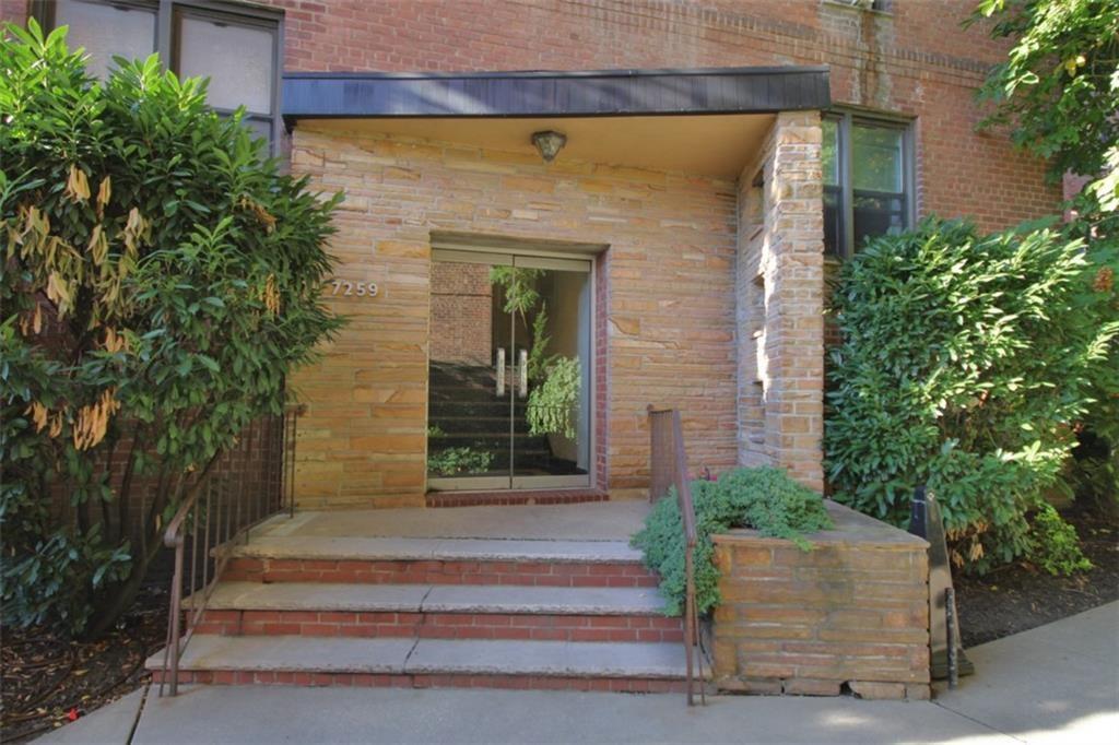 7259 Shore Road, Unit 5A Brooklyn, NY 11209 - Photo 3 of 18 a front view of a house with potted plants