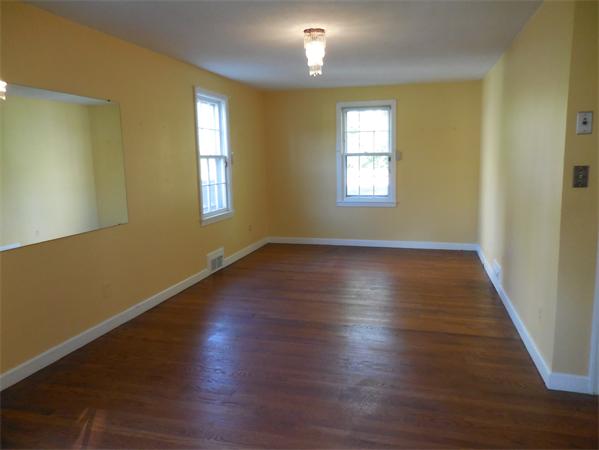 51 Pilgrim Road Springfield, MA 01118 - Photo 11 of 20 a view of an empty room with wooden floor and a window