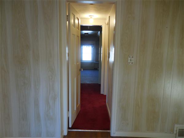 51 Pilgrim Road Springfield, MA 01118 - Photo 17 of 20 a view of a hallway with wooden floor