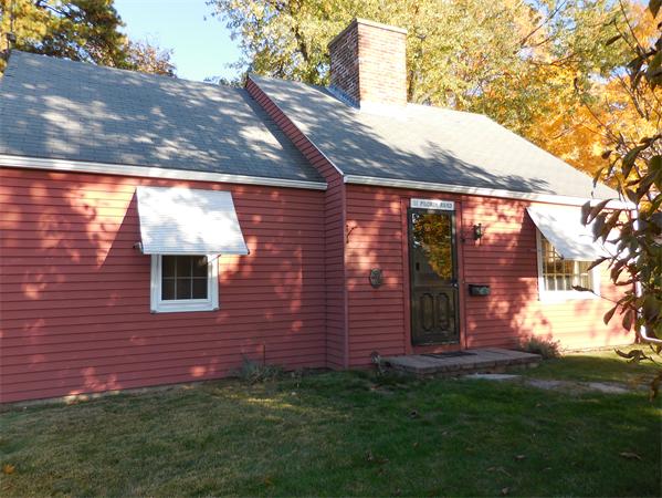 51 Pilgrim Road Springfield, MA 01118 - Photo 3 of 20 a view of backyard with brick wall and a large tree