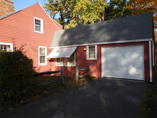 51 Pilgrim Road Springfield, MA 01118 - Photo 4 of 20 a front view of a house with a yard