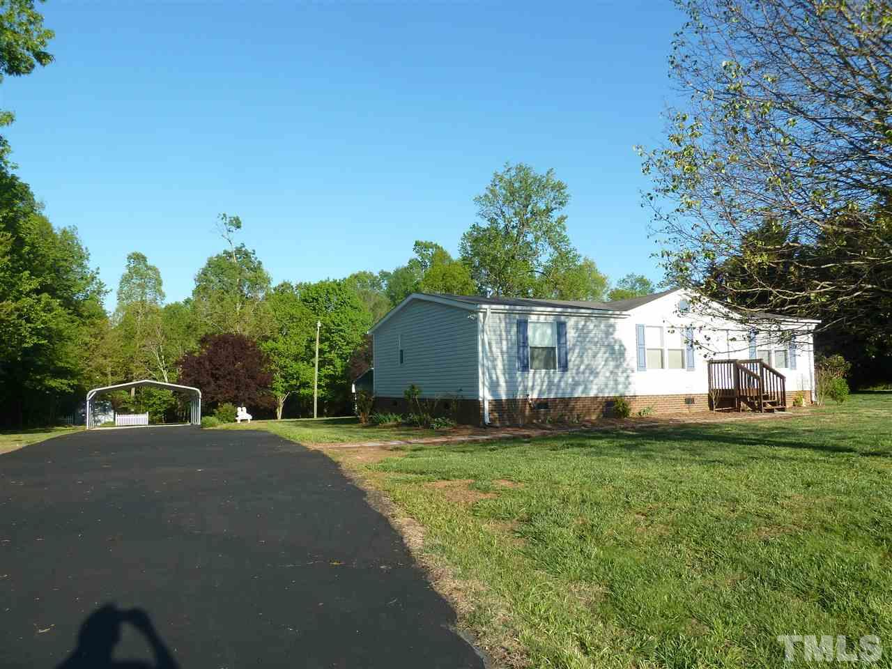 162 Isaac Trail Roxboro, NC 27574 - Photo 2 of 20 a view of a house with a yard
