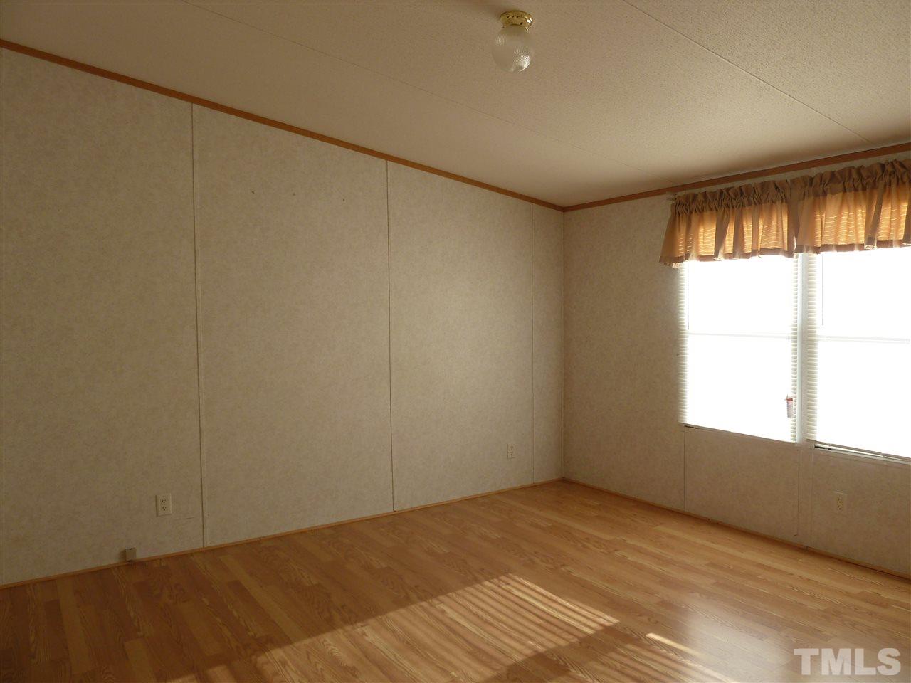 162 Isaac Trail Roxboro, NC 27574 - Photo 14 of 20 a view of an empty room with a window